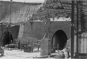 US investgators in front of the G1 and G2 railway entrance of the KZ Gusen II "Bergkristall" underground plant (June/July 1945; Me-262 fuselage in lower right corner)